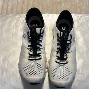 On Running White and Black Athletic Shoes